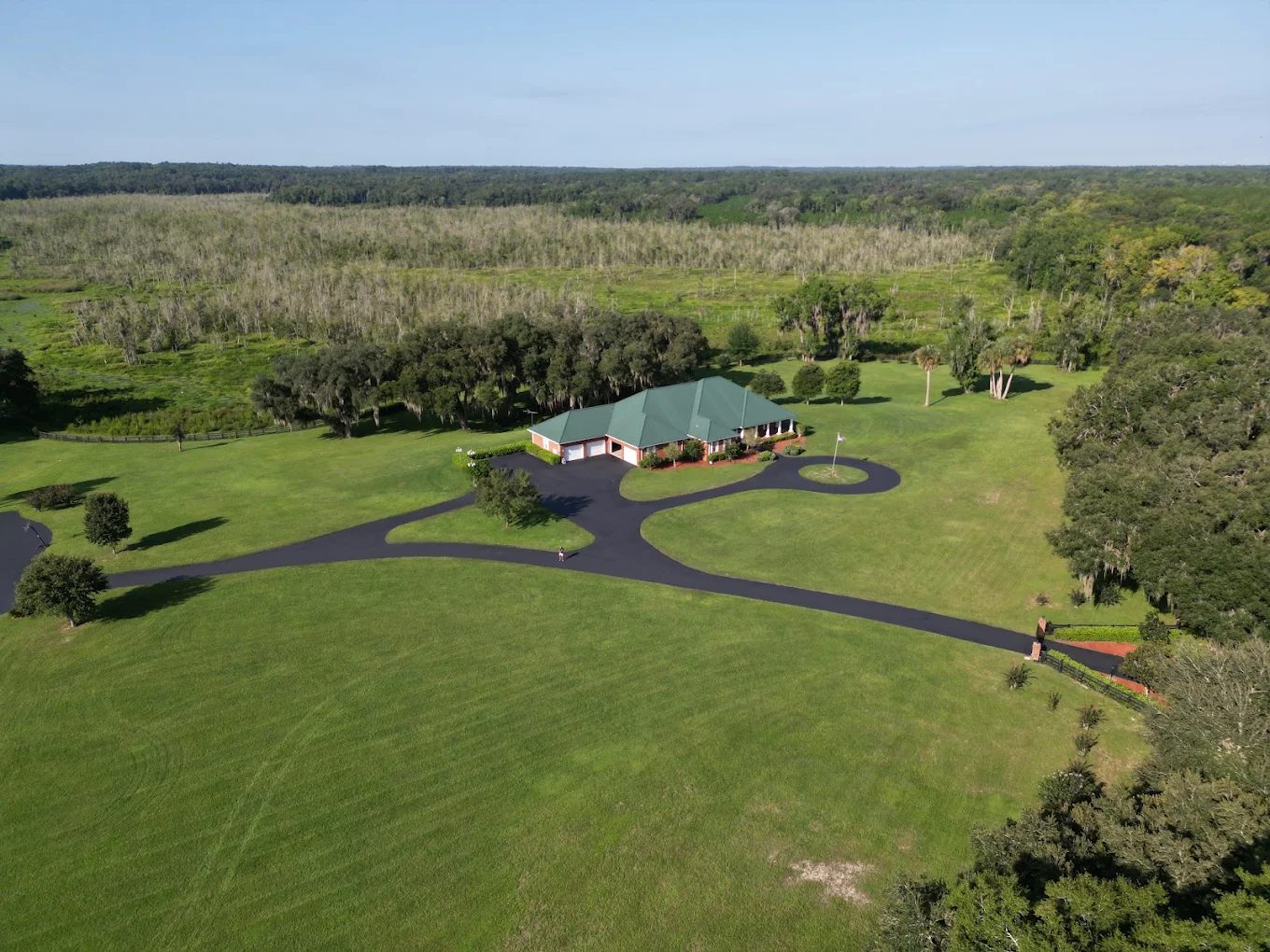 Drone view of a winding Armour Asphalt estate driveway in North Central Florida