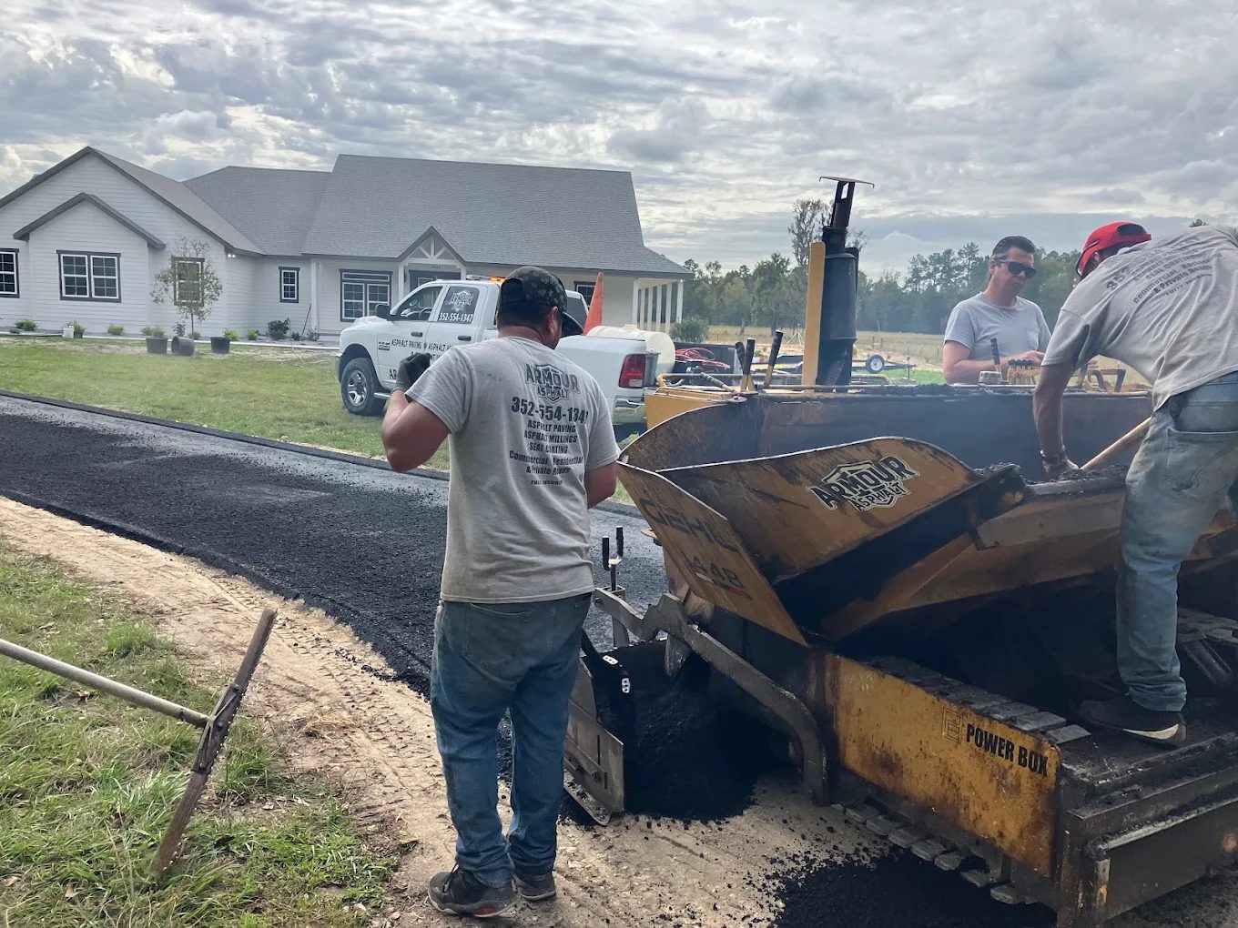 Crew at the paver, an Armour Asphalt project